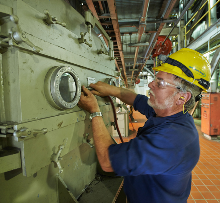 man in hard hat performing work